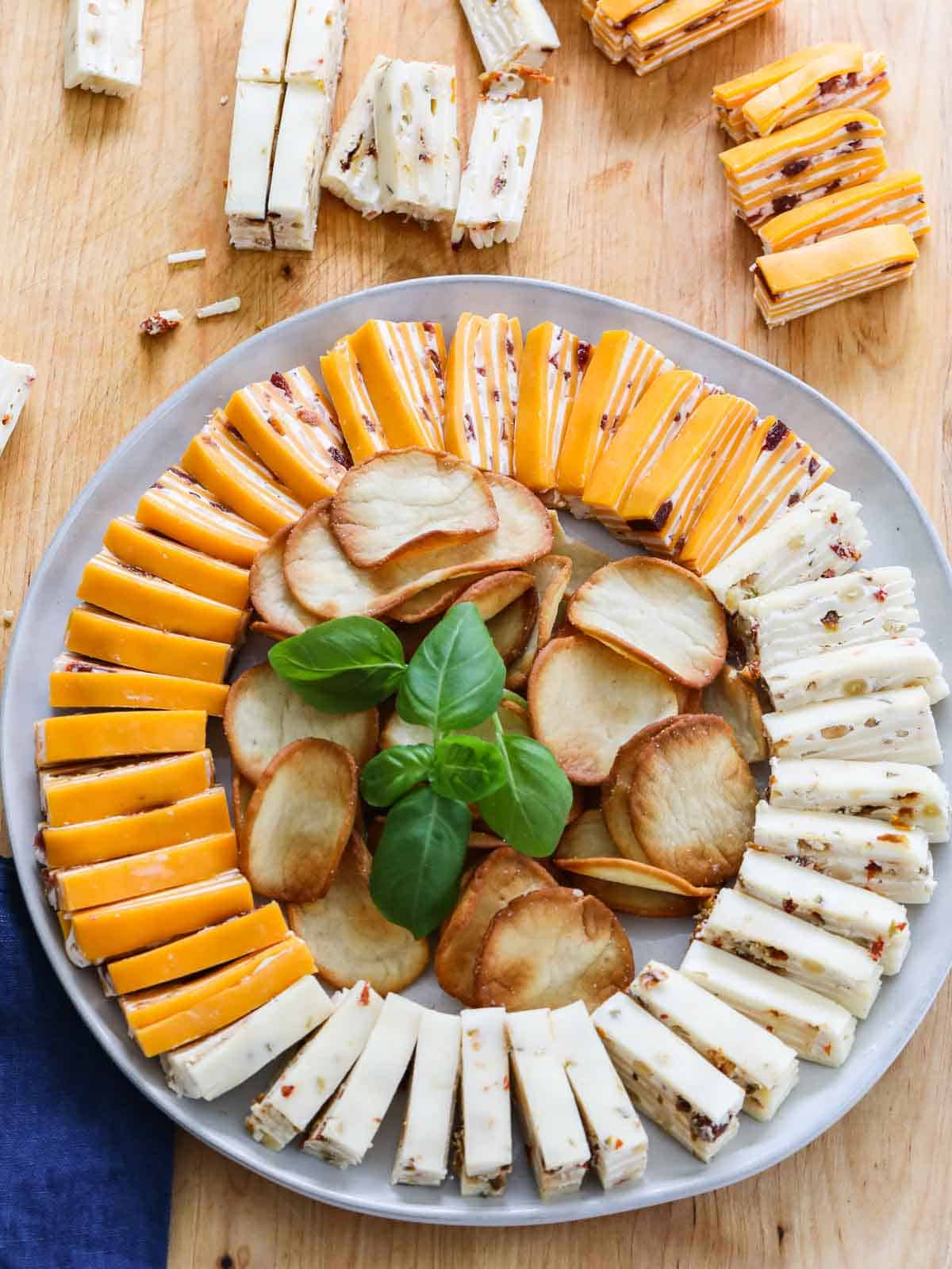 https://www.delicioustable.com/wp-content/uploads/2021/11/Cheese-Appetizer-sliced-on-platter.jpg
