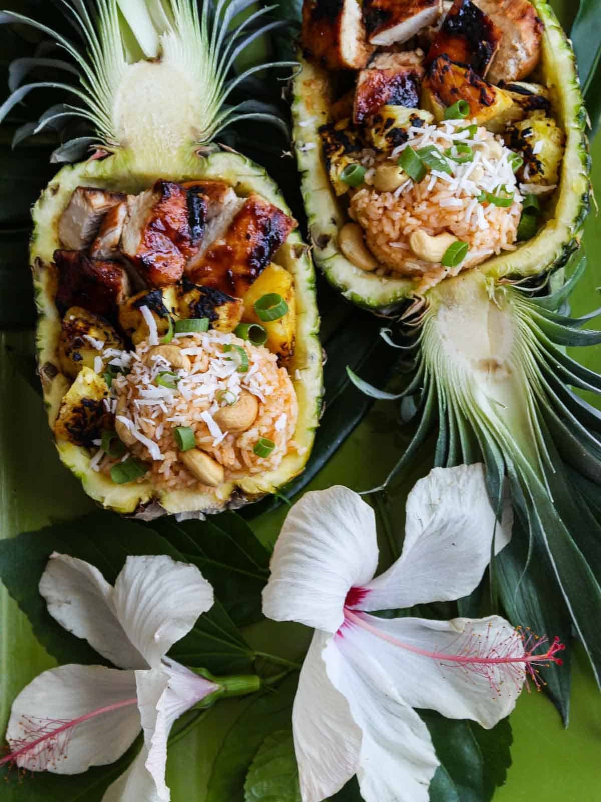 https://www.delicioustable.com/wp-content/uploads/2022/02/Two-Huli-huli-chicken-pineapple-bowls.jpg