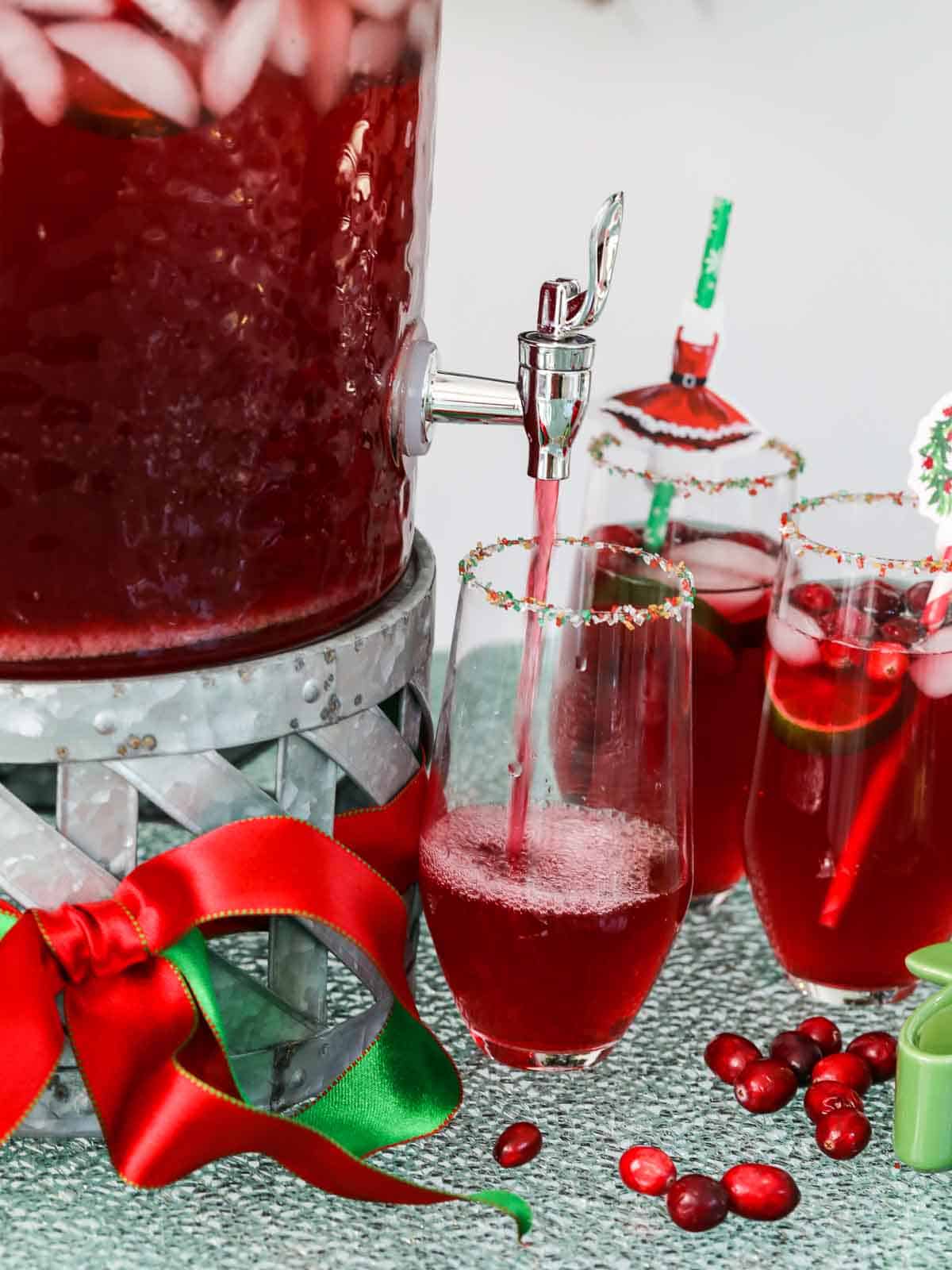https://www.delicioustable.com/wp-content/uploads/2022/11/Pouring-Christmas-punch-bubbles.jpg